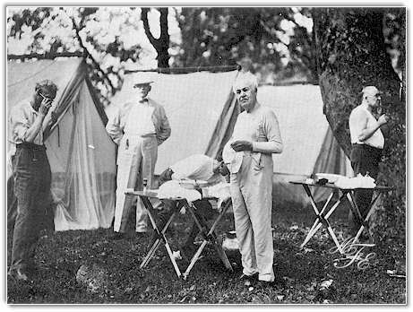 Shaving time on a summer morning in 1921 in the Great Smokies. Left to right: Henry Ford, Bishop William F. Anderson, Harvey Firestone (stooping). Thomas A. Edison and President Warren G. Harding. Ford seems to be managing without a mirror, perhaps in deference to the President who is making use of one. Bishop Anderson, fully dressed, apparently was an early riser. Firestone, Edison and the President display a variegated assortment of undershirts.